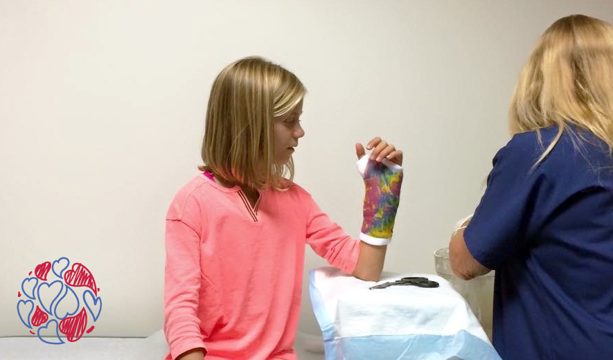 Our star striker Abby putting on a brave face as she gets her cast applied following a nasty wrist fracture.